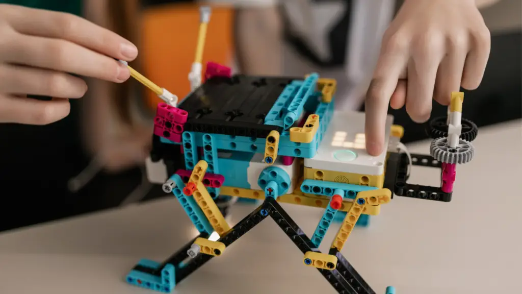 man painting a LEGO set